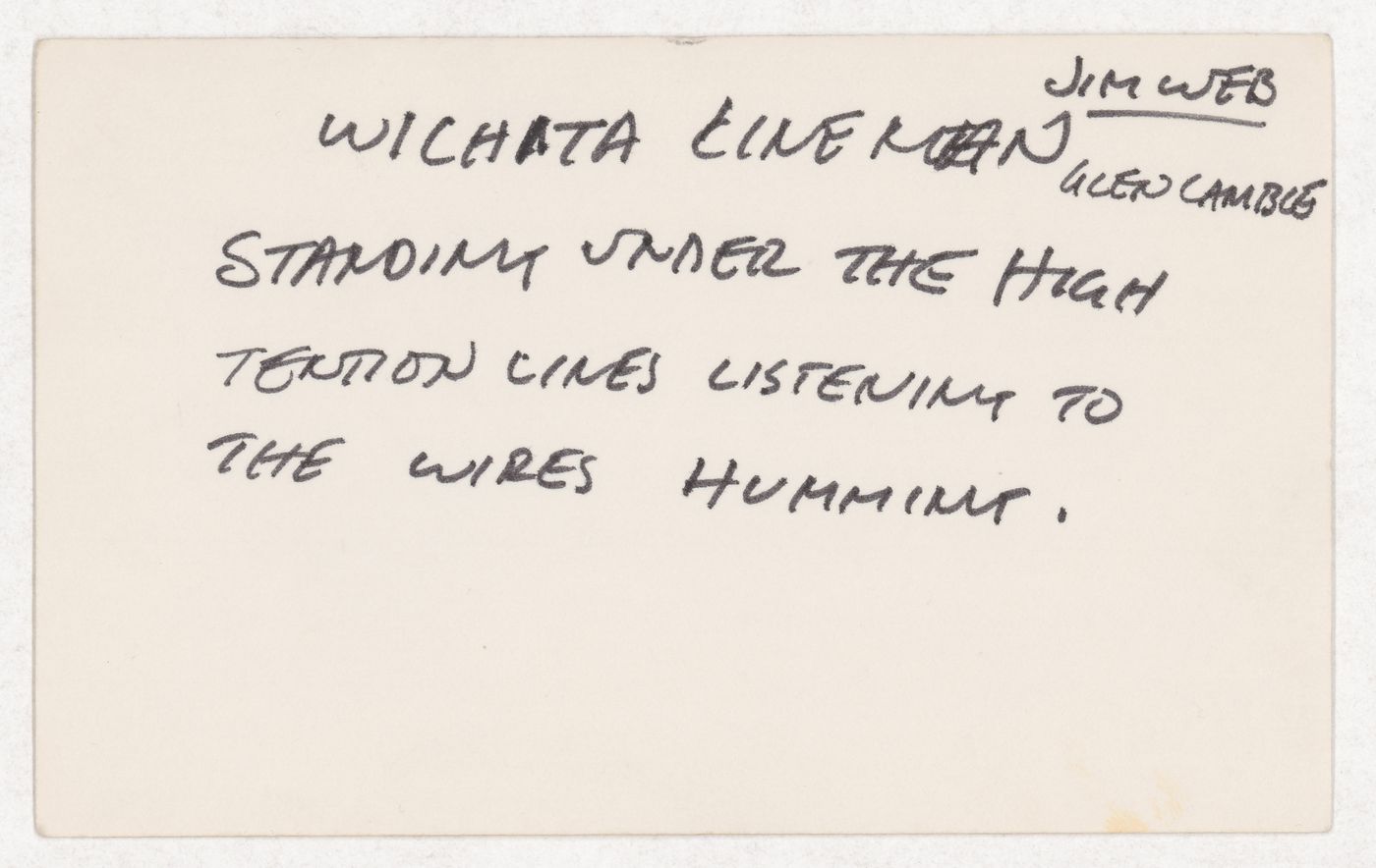 Wichita line man Jim Web Glen Camble standing under the high tension lines listening to the wires humming