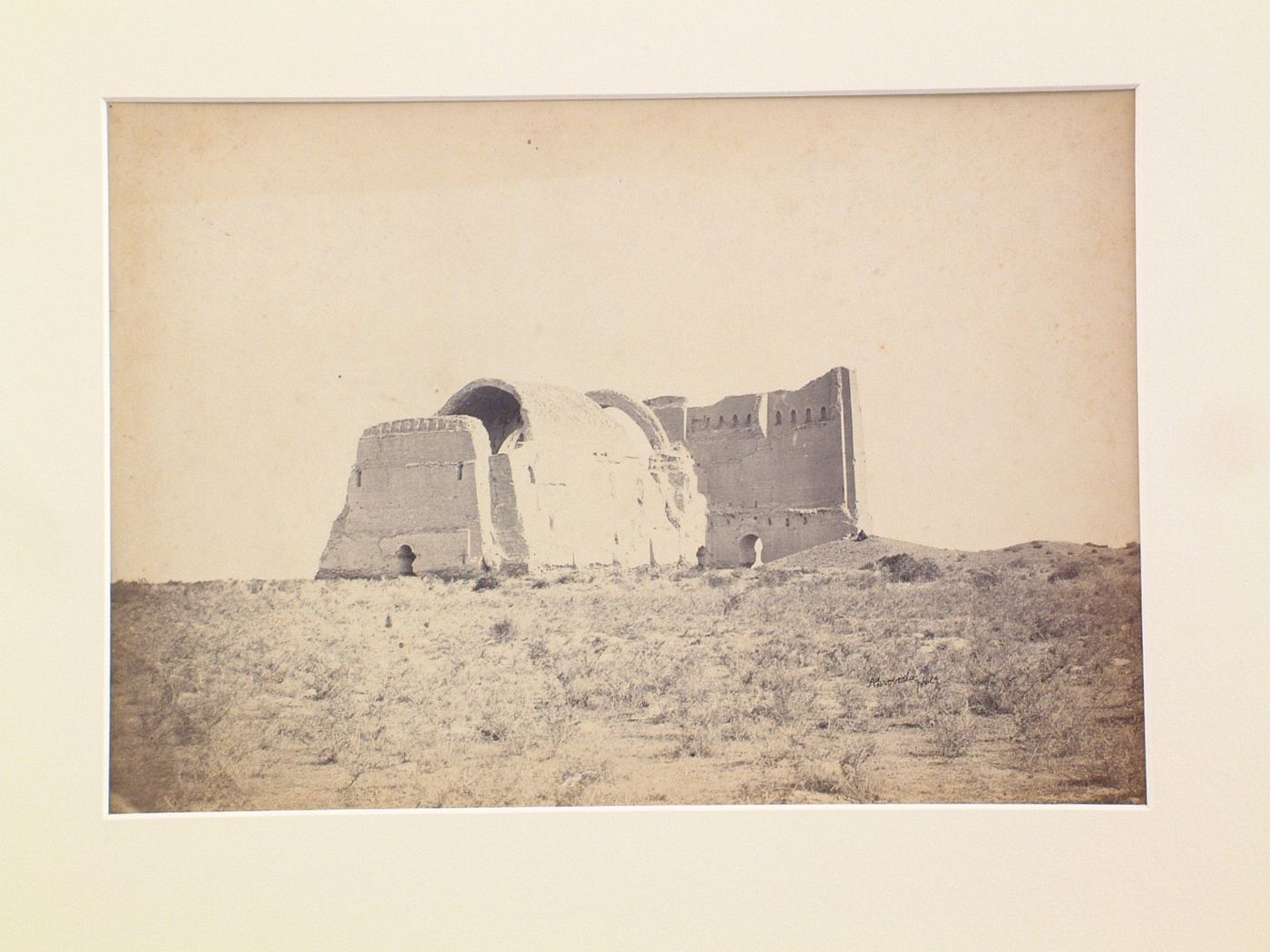 Distant view of the southern façade of the Taq-i Kisra [Iwan of Khusraw] (also known as the Taq-i Khusrau, Iwan-i Kisra and Taq-e Kisra), Ctesiphon (now Al Madain), Ottoman Empire (now in Iraq)