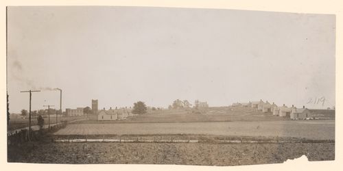 Fields in foreground, houses on hill, Hill Village, Mississippi