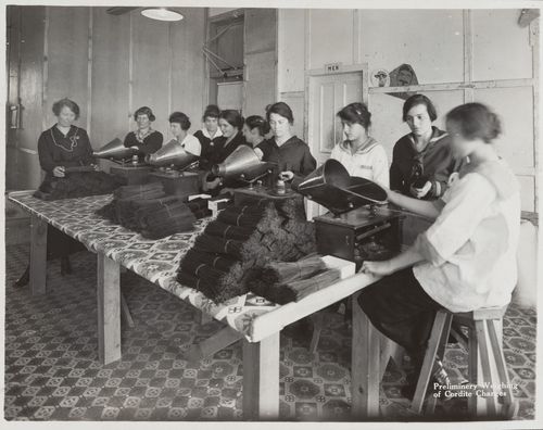 Interior view of workers weighing cordite charges at the Energite Explosives Plant No. 3, the Shell Loading Plant, Renfrew, Ontario, Canada