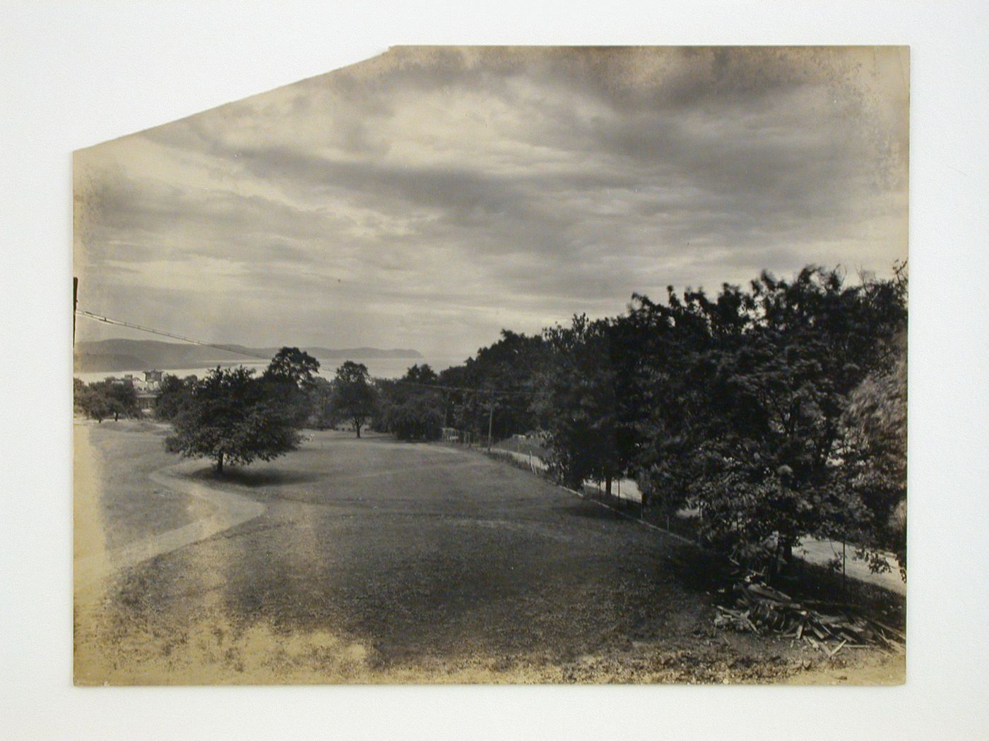 Partial view of the Longue Vue Golf Course showing a road on the right with a view of a river in the distance, New York [?], United States