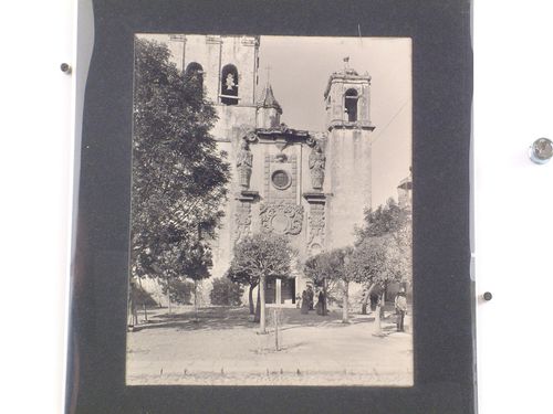 Partial view of the principal facade of the Church of the Convento de Santo Domingo de Querétaro with people in the foreground, Querétaro, Mexico
