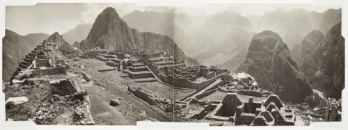 Partial view of Machu Picchu from the King's Group showing the Sacred Plaza, Intihuatana Hill, the Main Square and the Industrial Sector with mountains in the background, Peru