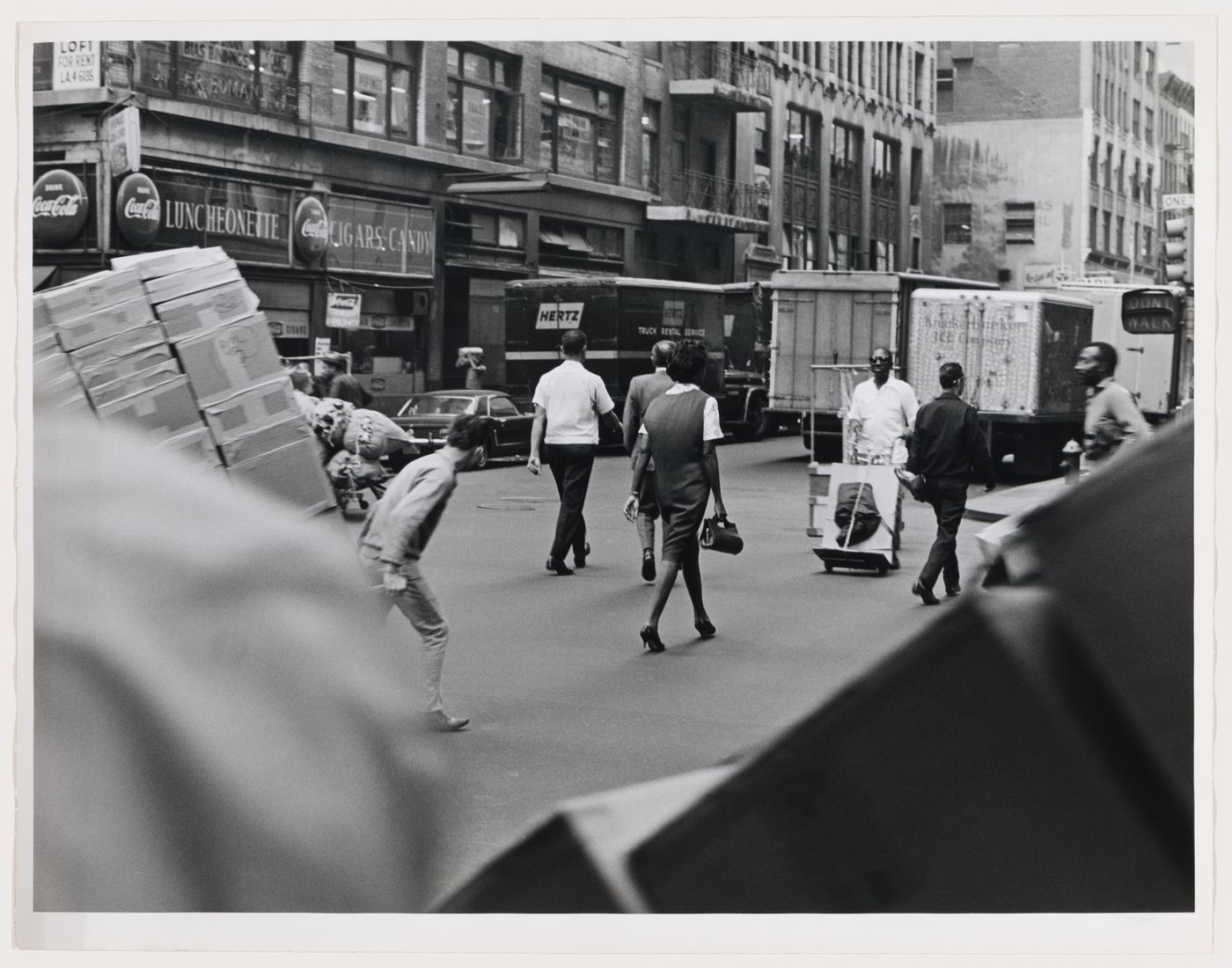 Street view with pedestrians, workers, service trucks and building facades, West 37th Street, Manhattan, New York City, New York
