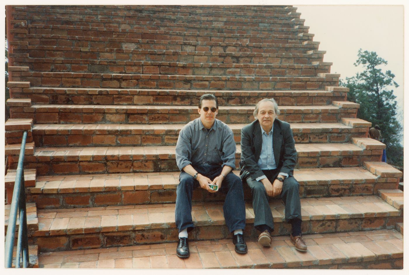 Photograph of Gianni Pettena and an unidentified person in sunglasses at Casa Malaparte in Capri, Italy