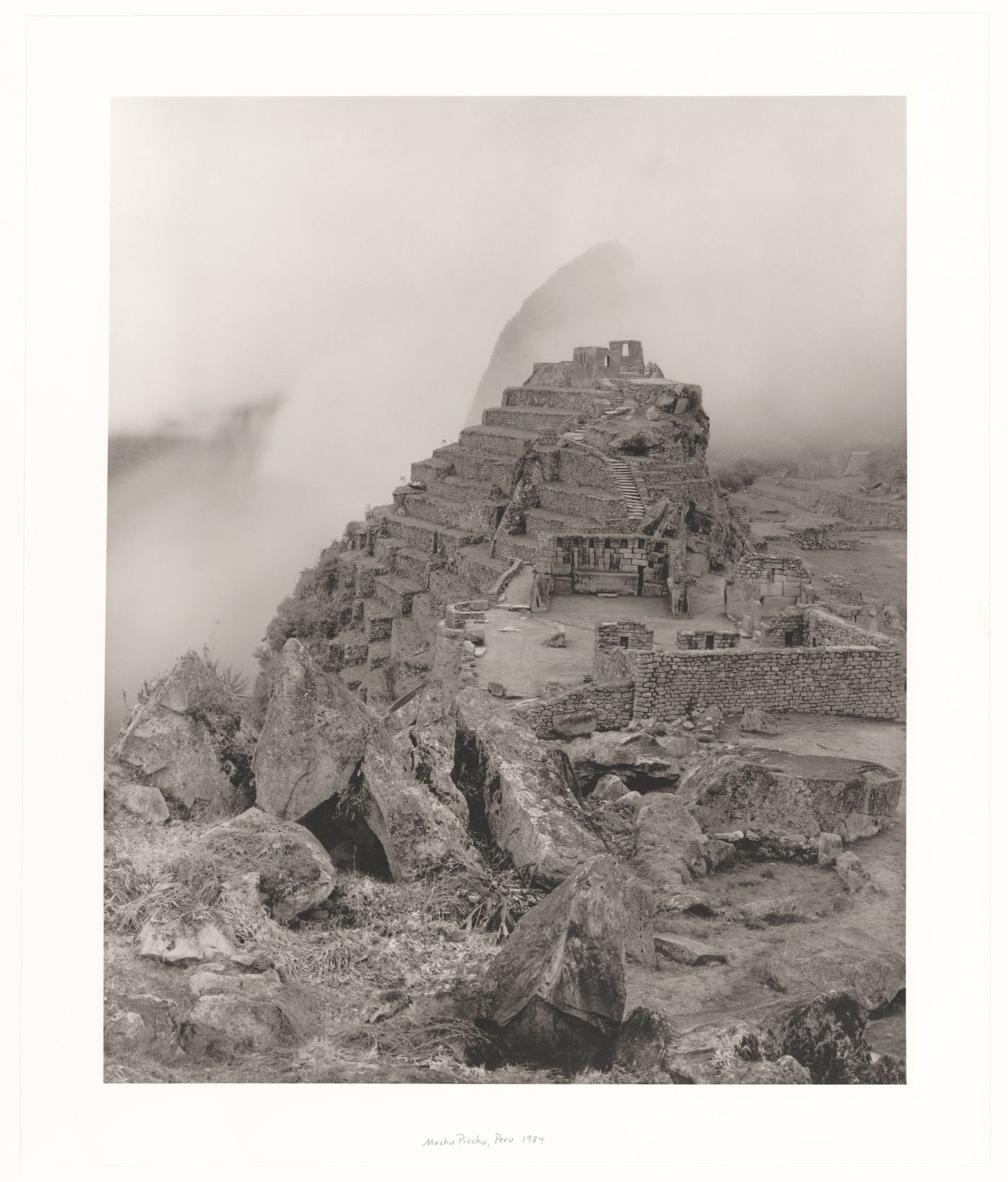 View of the Sacred Plaza showing the High Priest's House, the Temple of the Three Windows, the Principal Temple and with Intihuatana Hill in the background, Machu Picchu, Peru