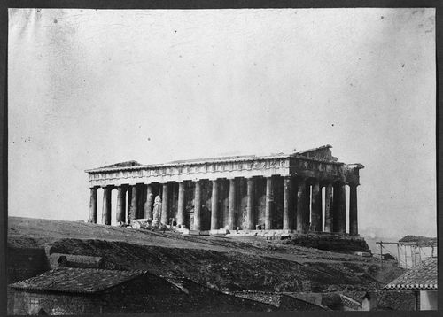 Temple of Theseus on hill, house roofs in foreground, Athens, Greece