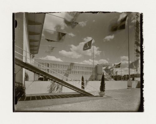 View of the lateral façade of hall 27 at the Stockholm Exhibition of 1930 showing a walled garden and stairs, Stockholm