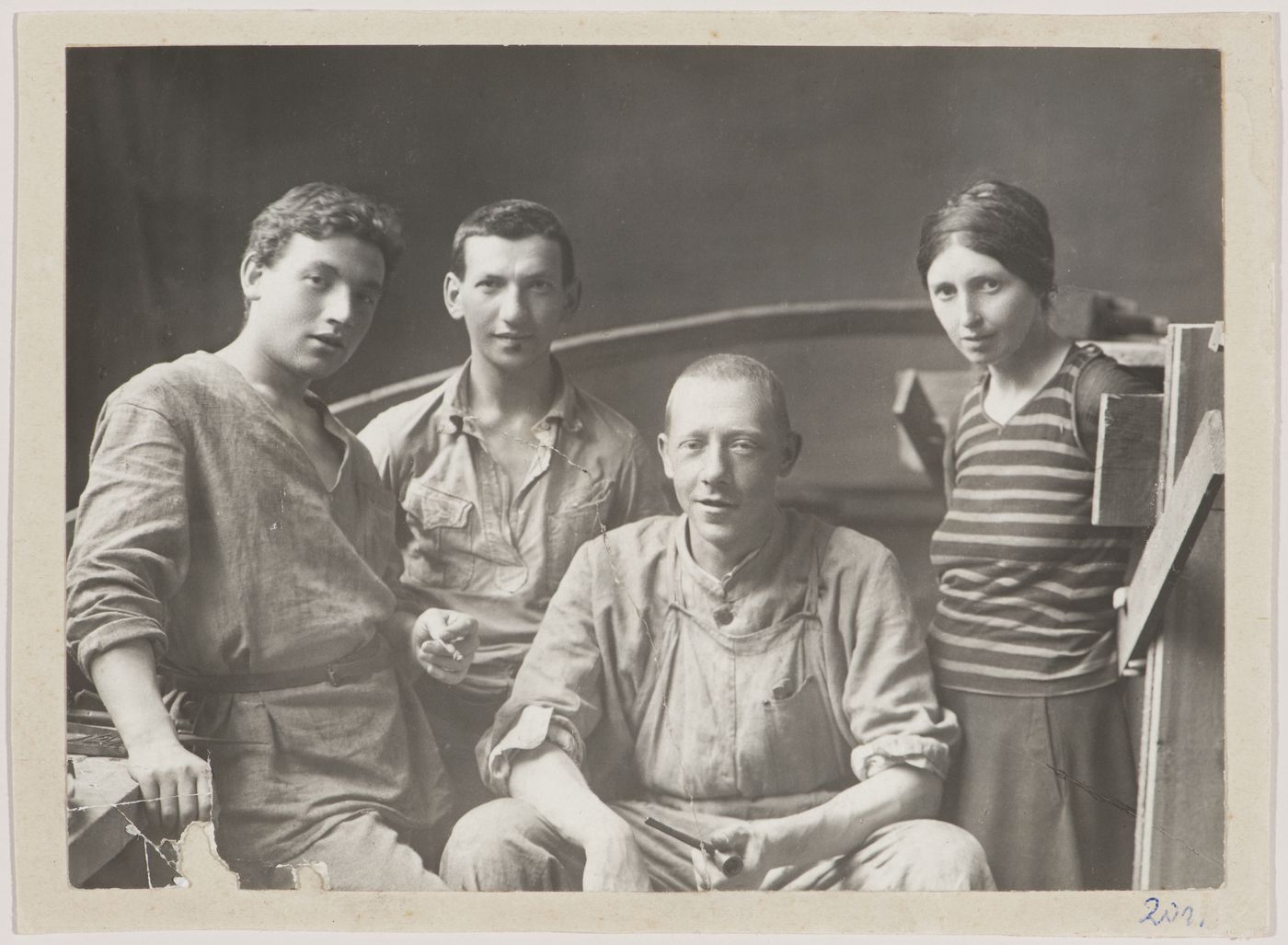 Group portrait of Vladimir Tatlin and his assistants I.A. Meerzon, T.M. Shapiro and S. Dymshits-Tolstaia at the time of the construction of the model for the Monument to the Third International, Petrograd (now Saint Petersburg)