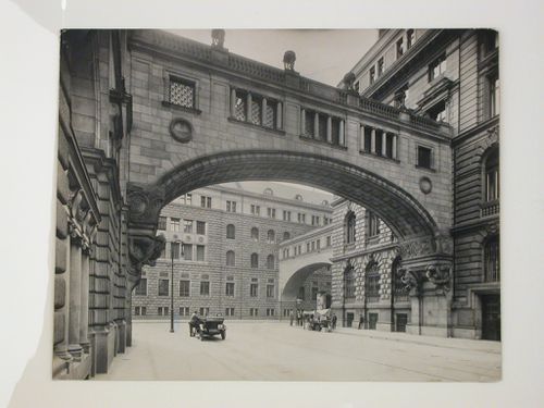 View under a skybridge showing buildings and people, corner of Französischestraße and Mauerstraße [?], Berlin, Germany