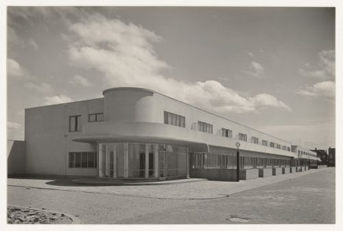 View of the principal façade of industrial row houses showing a corner store, Hoek van Holland, Netherlands