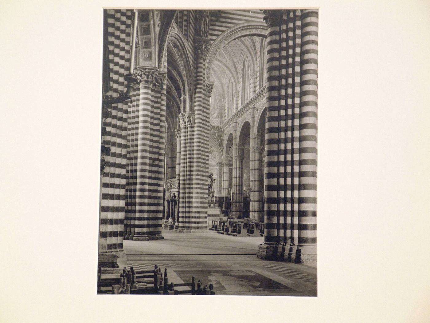 Interior of cathedral, detail of piers with horizontal stripes, possibly Siena, Italy