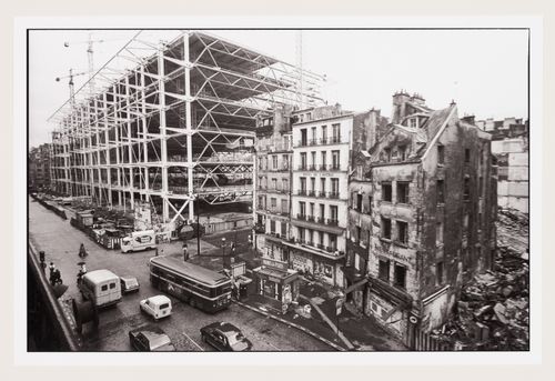Day time view of Intersection of rue Beaubourg and rue Rambuteau with construction of Centre Georges Pompidou in background, Paris