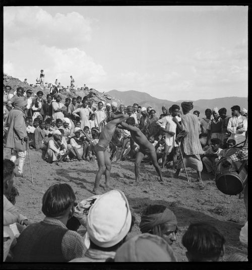 Crowd watching a wrestling match in Chandigarh's area before the construction, India