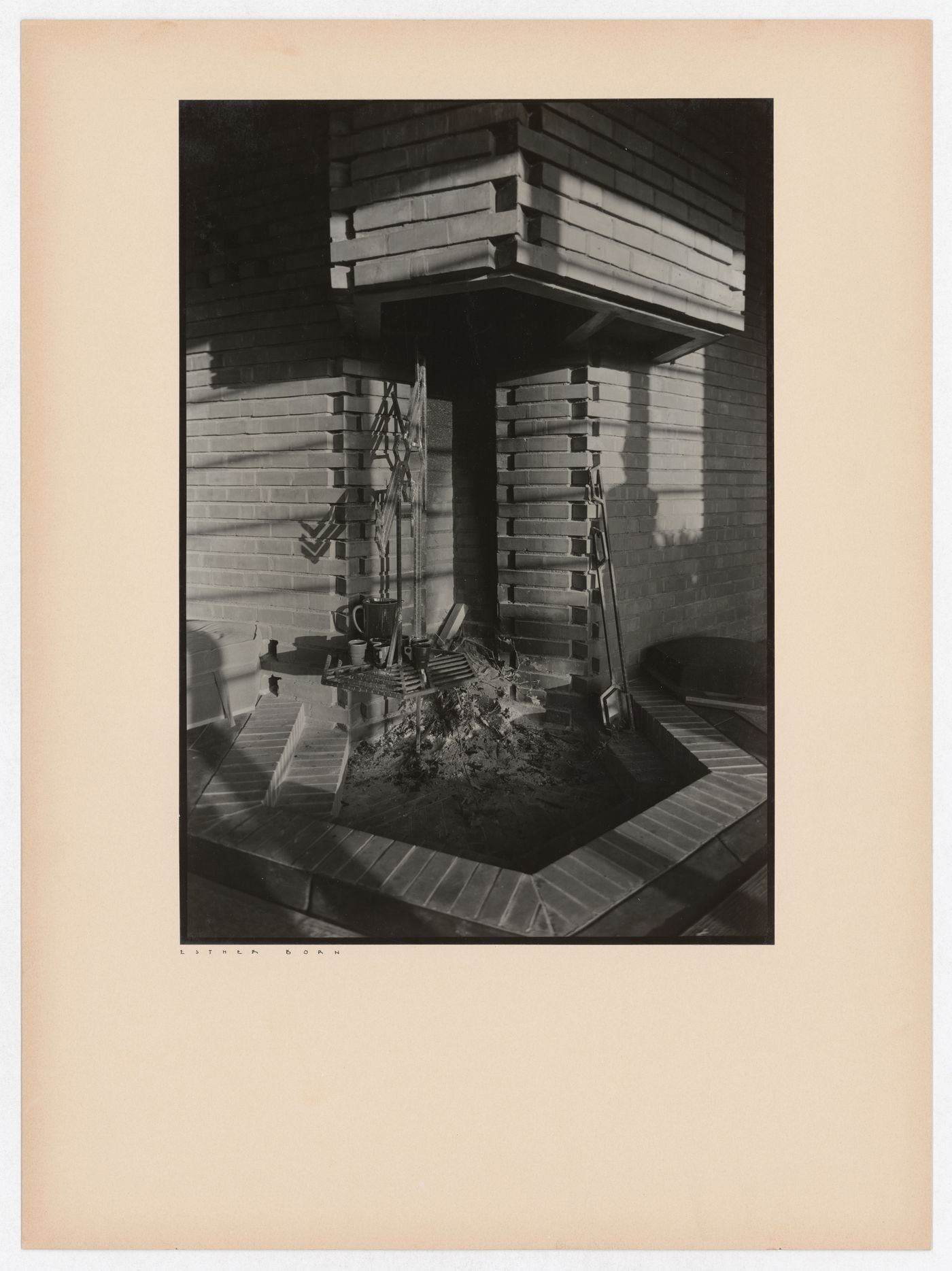 Interior view of the Hanna House showing a fireplace and a fireset, Palo Alto, California, United States