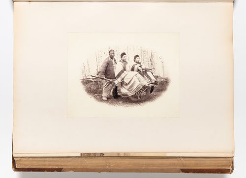 Vignette of two women riding in a wheelbarrow pushed by a man, Shanghai, China