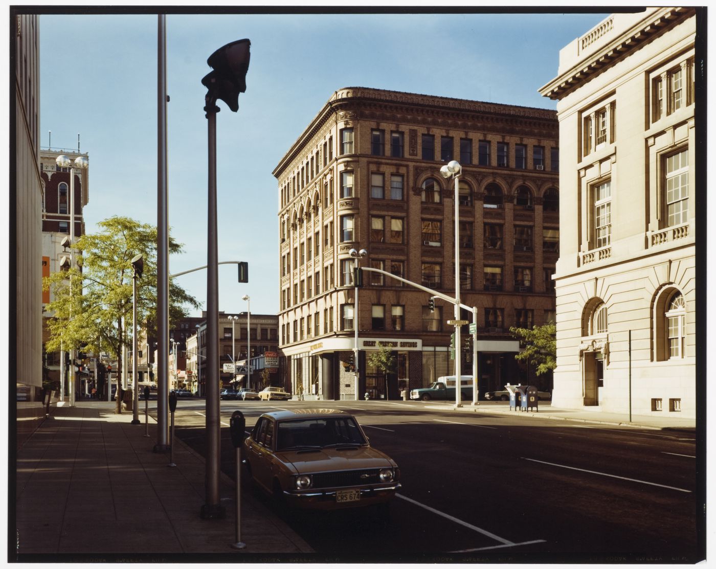 View of 2 buildings and a car, Lincoln St. and Riverside St., Spokane, Washington