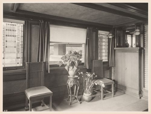 Interior view of Darwin D. Martin House showing the dining room looking out the stained glass windows designed by Orlando Giannini toward the east porch, Buffalo, New York