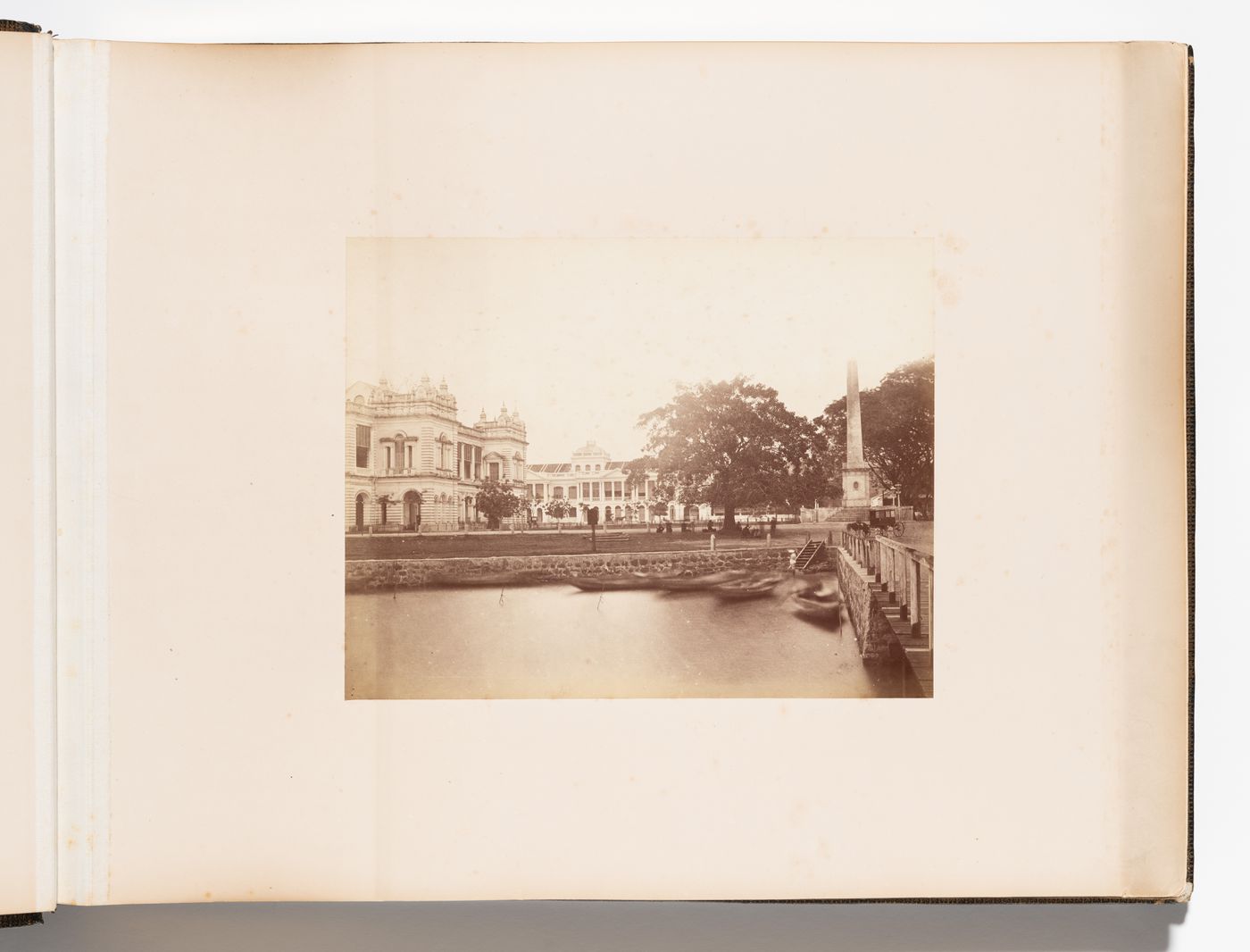 View of the Dalhousie Obelisk (also known as the Dalhousie Memorial) with unidentified buildings on the left and in the background and a unidentified bridge in the foreground, Singapore
