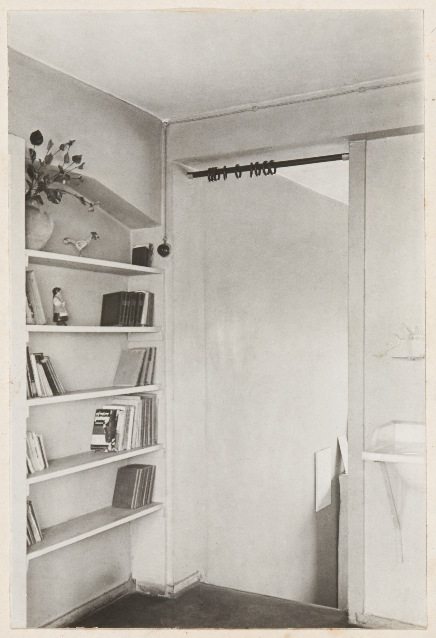 Interior view of a Type F unit apartment showing built-in bookshelves, 8 Gogolevskii Boulevard, Moscow, USSR