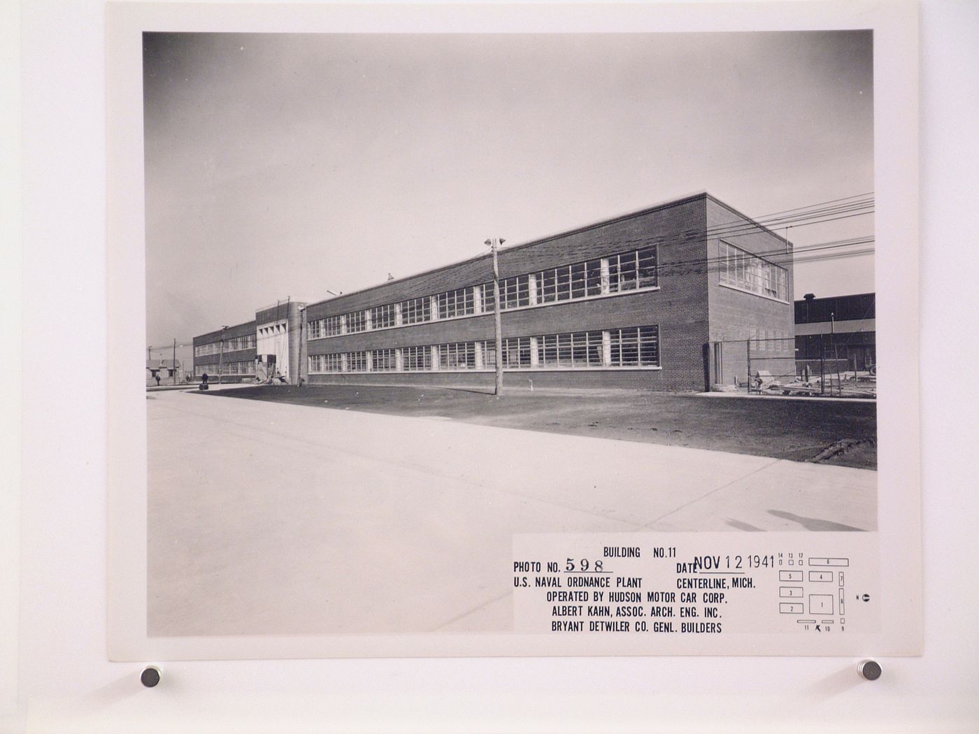 View of the principal and lateral façades of the Administration Building (also known as Building No. 11) under construction, United States Naval Ordnance Assembly Plant, Center Line, Michigan