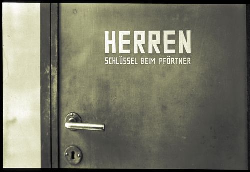 Detail of men's room door: Herren/Schusselbein, Germany