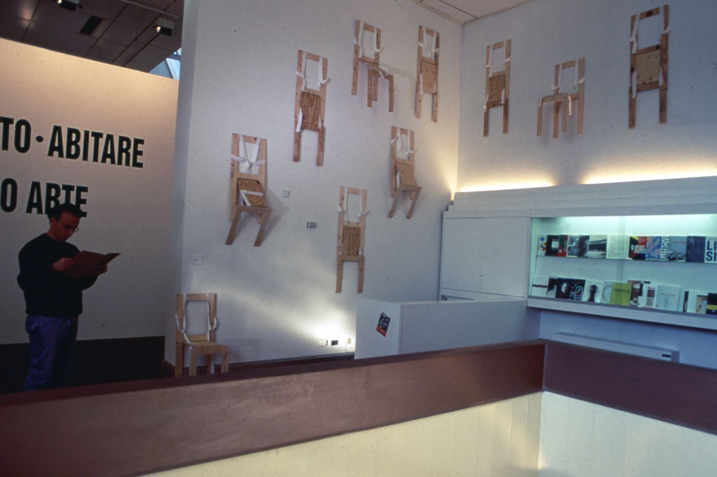 Slide of wearable chair installation and visitor at Minneapolis Institute of Art for performance Vestirsi Di Siede