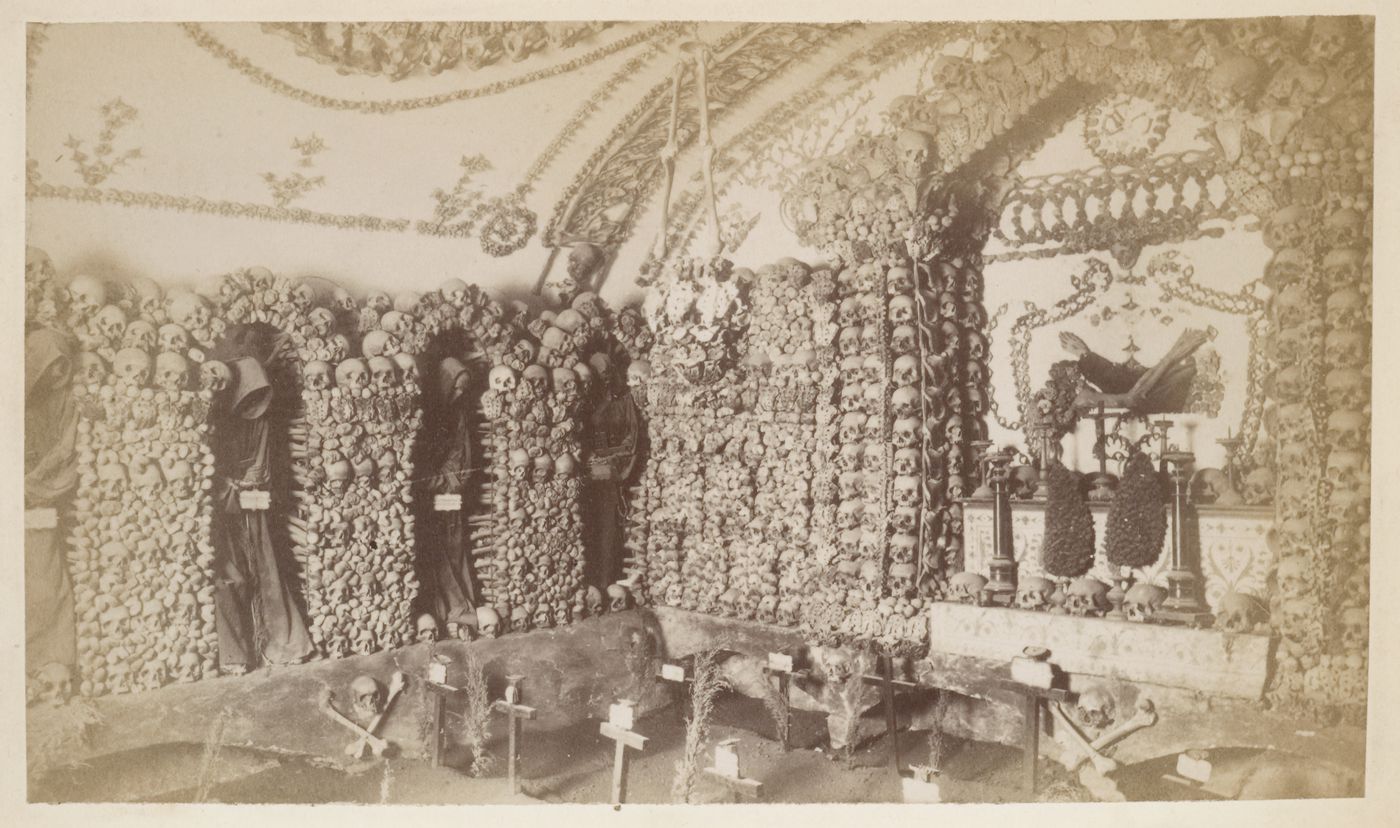 Interior of a graveyard with altars and niches composed of skulls and other skeletal bones, Rome, Italy