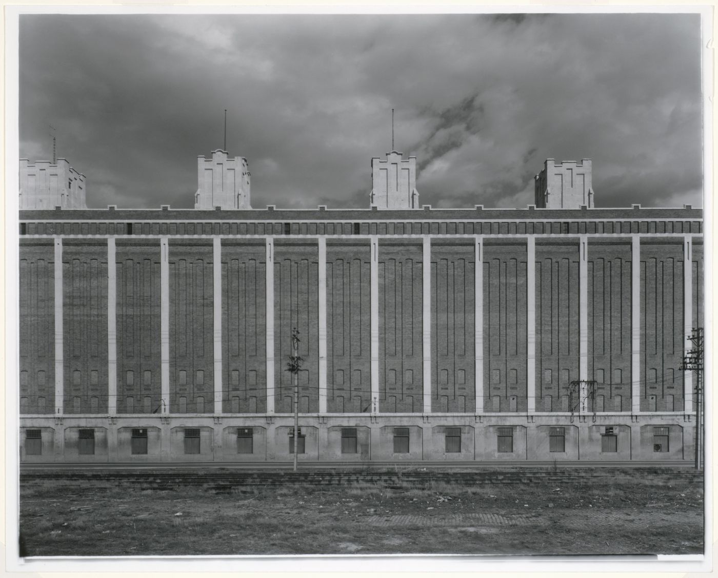 Partial view of the north façade of the Cold Storage Warehouse with railway tracks in the foreground, Port of Montréal, Québec