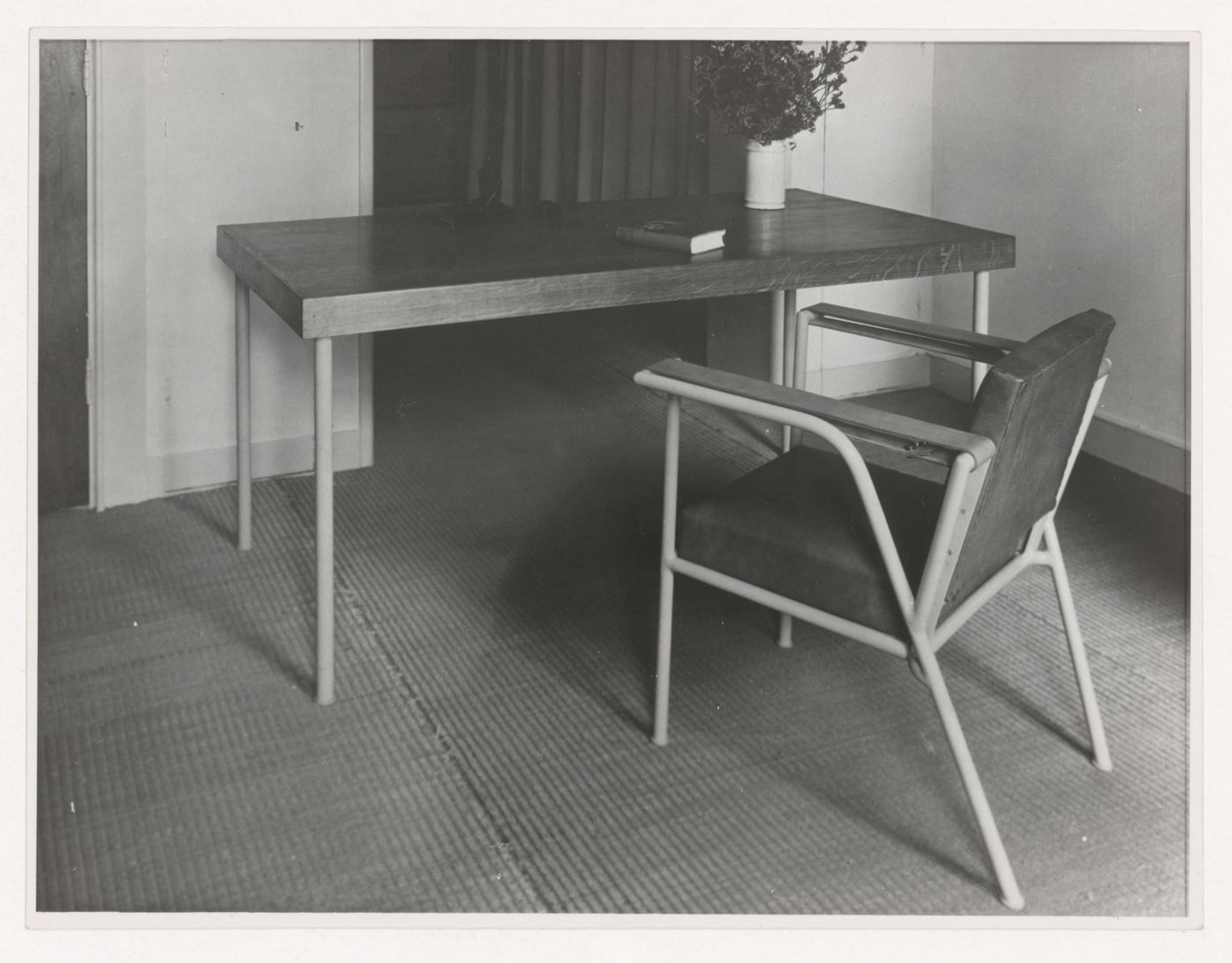 Interior view of Hannema House I showing a table and armchair designed by J.J.P. Oud, Rotterdam, Netherlands