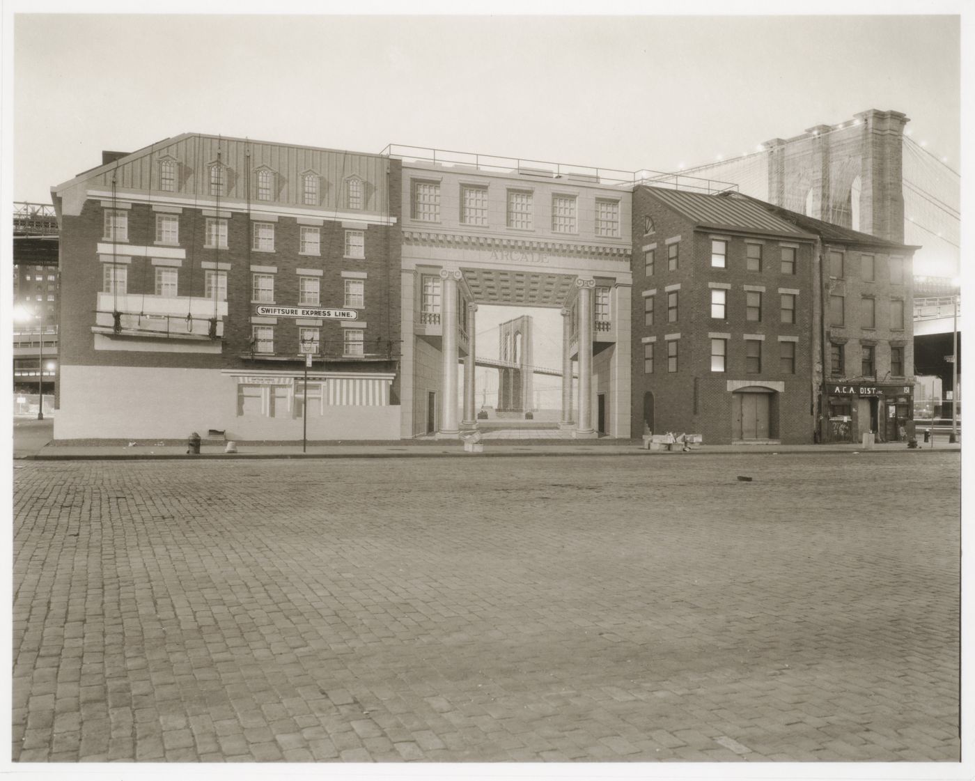 Row of buildings with unfinished mural including Brooklyn Bridge painted on the façade with Brooklyn Bridge visible behind them, New York City, New York