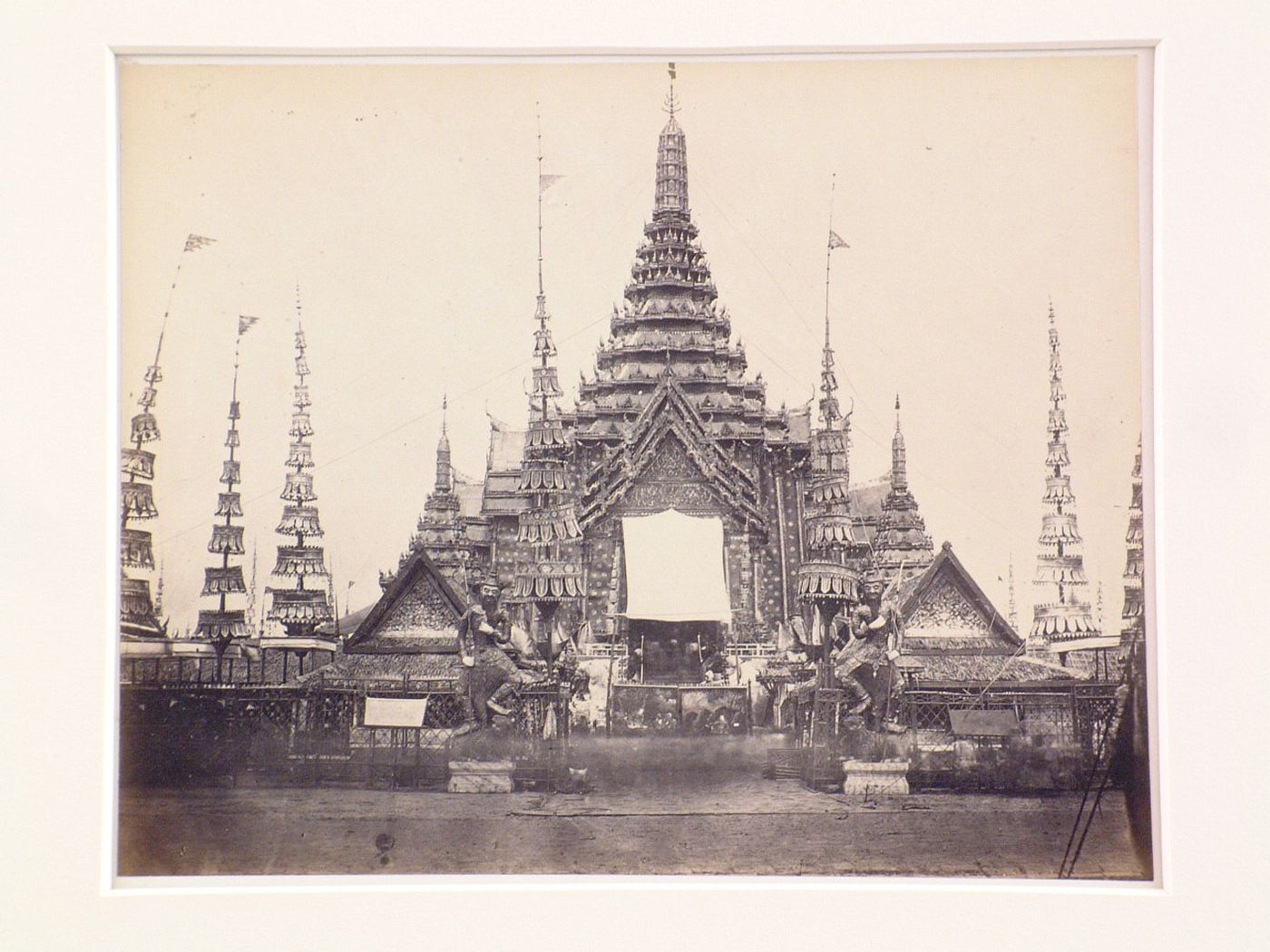 View of a temple showing stupas, religious objects and statues, probably in Bangkok, Siam (now Thailand)