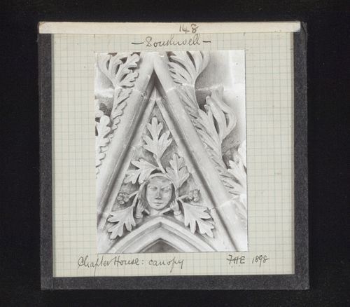 View of canopy with foliate mask on tympanum in Chapter House, Southwell Minster, Southwell, Nottinghamshire, England