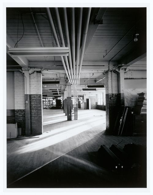 Interior view of an office area on the third floor of the administration building of the Belding Corticelli Spinning Mill showing pneumatic dispatch tubes, Montréal, Québec