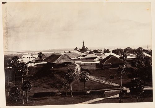 View of houses with a stupa and a river in the background, Rangoon (now Yangon), Burma (now Myanmar)