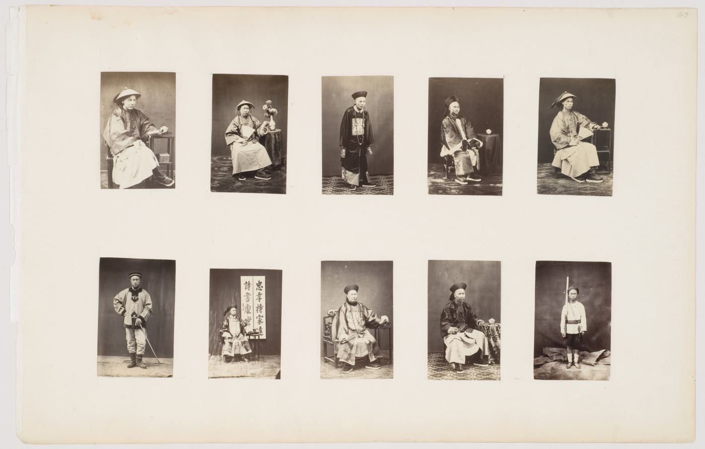 Portrait of a Chinese mandarin seated bside beside a stand