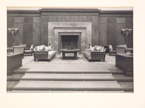 Interior of a large living room with marble fireplace, with three shallow steps in foreground, Munich, Germany