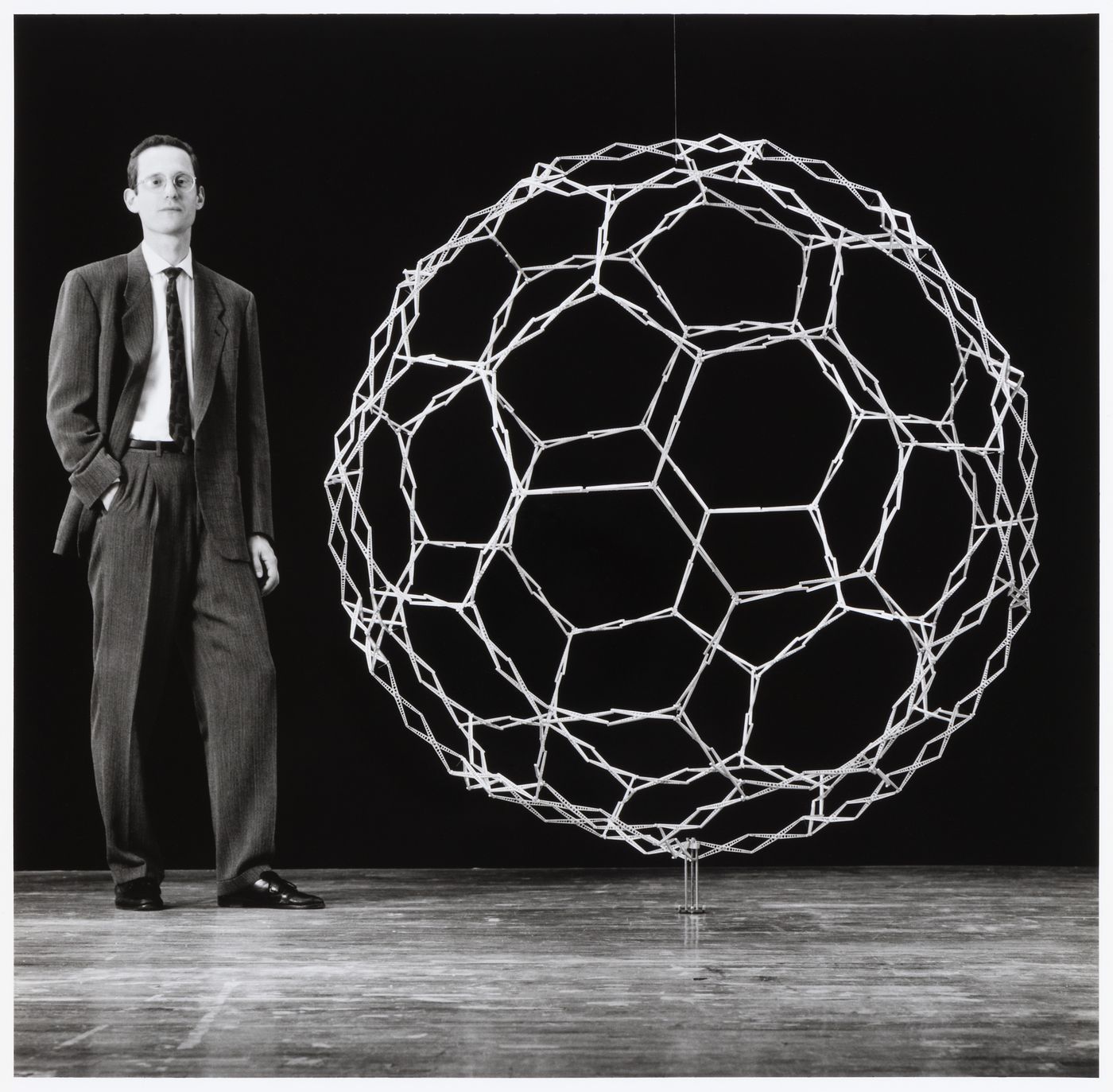 Chuck Hoberman with expanding aluminum sphere