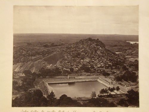 View of Chandragiri with a water tank and buildings in the foreground and temples, including the Parshvanatha Basti and Chamundaraya Basti (also known as the Camunda Raya Basti) in the left background, Shravana Belgola (now Sravana Belgola), India