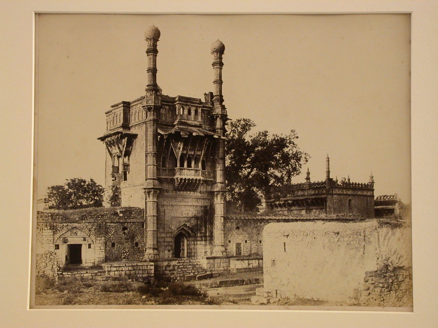 View of the gatehouse of the Mehtar Mahal [Sweeper's Palace] with a mosque on the right, Beejapore (now Bijapur), India