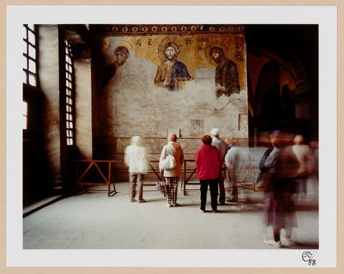 Interior view of Ayasofya Müzesi (also known as Hagia Sophia) showing museum visitors looking at a mosaic on a south gallery wall, Istanbul, Turkey