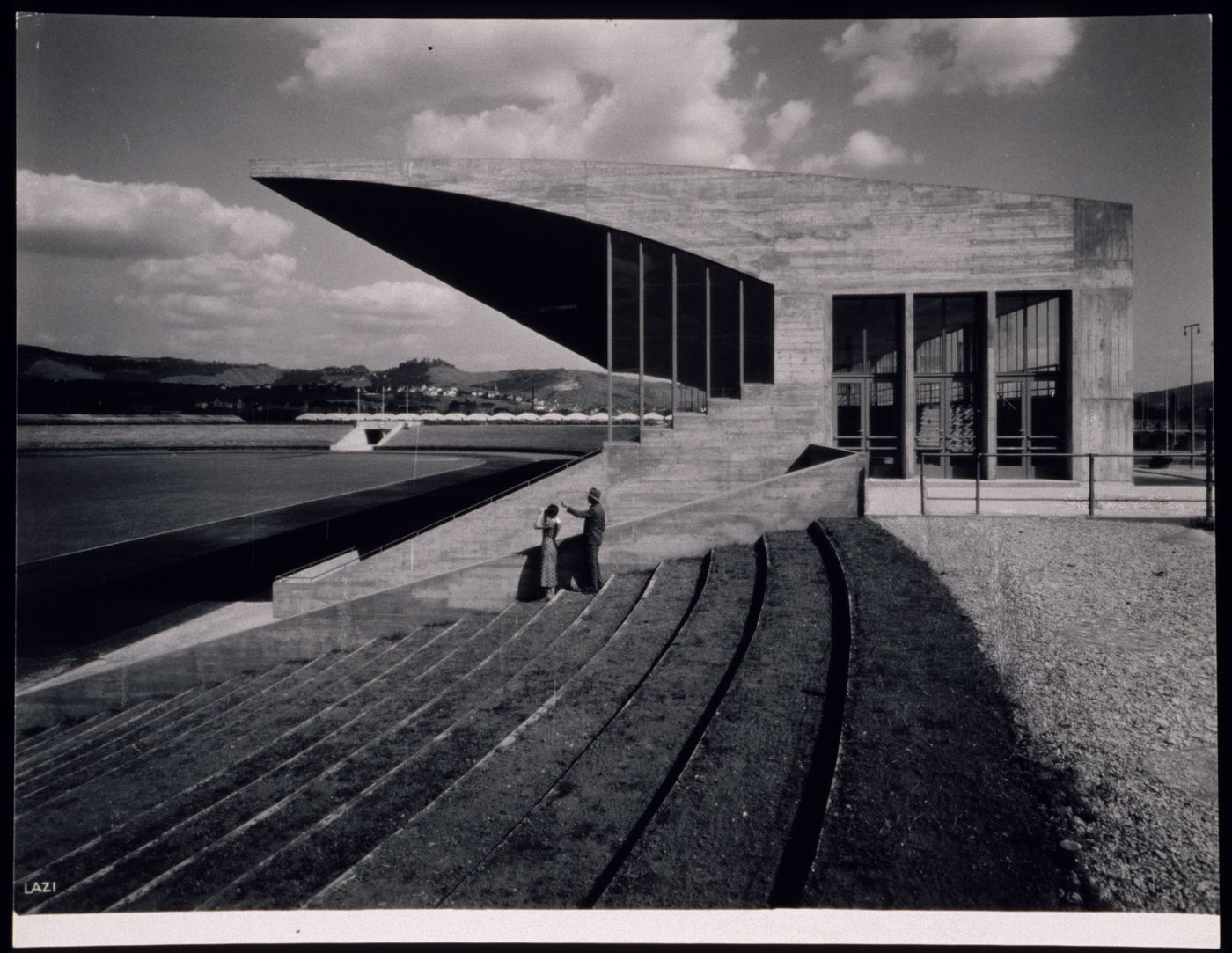 View of open-air stadium with concrete, protected seating area, Germany