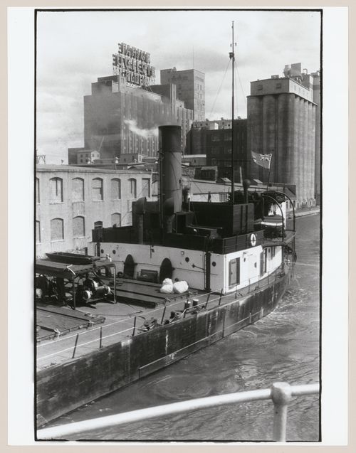 View of a ship on the Lachine Canal with the Farine Ogilvie Flour Plant in the background, Montréal, Québec, Canada