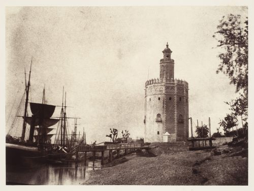 View of the Golden Tower with ships in the foreground, Seville, Spain