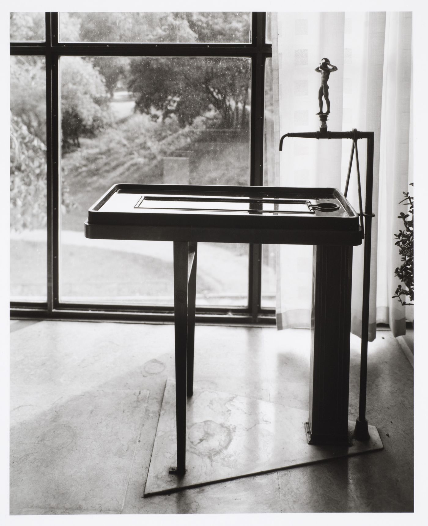 Interior view of a reading room of Stockholm Public Library showing a drinking fountain, 51-55 Odengatan, Stockholm, Sweden