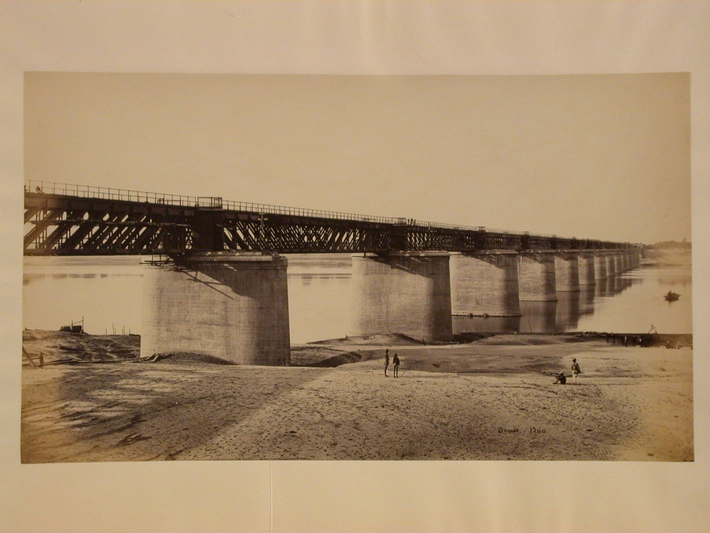 View of a railroad bridge, possibly known as the Papaman Bridge, over the Yamuna River (also known as the Jumna River), Allahabad, India