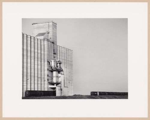 Modern grain elevators and train, Weyburn Inland Terminals Ltd., Weyburn, Saskatchewan, from the series The Forms of Canadian Industrial Architecture