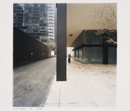 Exterior view of 880 Lake Shore Drive Apartments showing in the distance Phyllis Lambert taking a photograph back turned to the camera, Chicago, Illinois