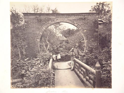 View of a garden showing a moon gate with a footbridge in the foreground, Canton (now Guangzhou), China