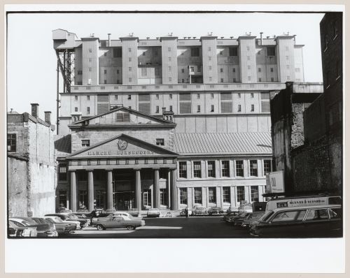 View of the principal façade of Marché Bonsecours with Grain Elevator No. 2 (now demolished) in the background, Montréal, Québec, Canada
